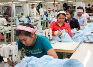 2_garment_workers_stitch_clothes_at_a_factory_in_the_outskirts_of_phnom_penh_in_2014_16_10_2014_pha_lina_0