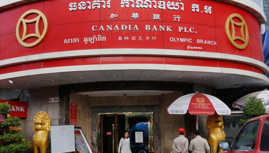business_customers_walk_out_of_a_canadia_bank_branch_in_phnom_penh_last_month_pha_lina
