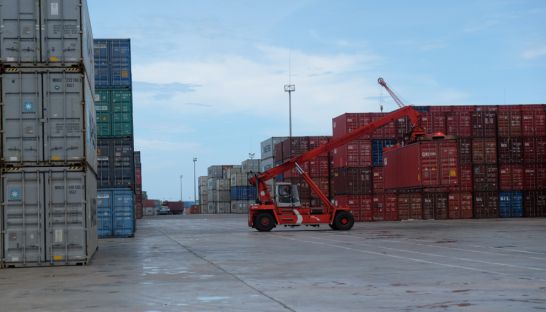business_a_cargo_container_is_lifted_for_shipping_earlier_this_year_at_the_sihanoukville_autonomous_port_sahiba_chawdhary