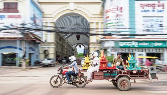 cambodian-men-ride-a-trailer