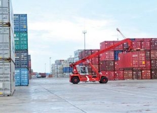 business_a-cargo-container-is-lifted-for-shipping-earlier-this-year-at-the-sihanoukville-autonomous-port_sahiba-chawdhary
