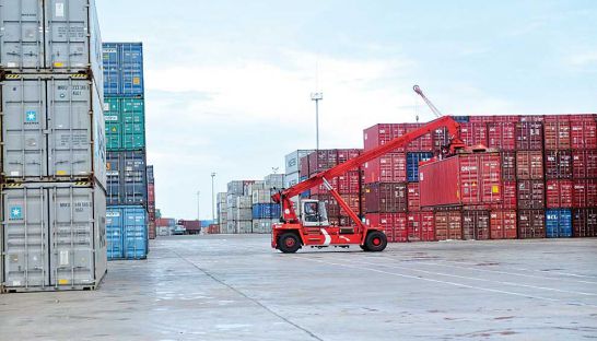 business_a-cargo-container-is-lifted-for-shipping-earlier-this-year-at-the-sihanoukville-autonomous-port_sahiba-chawdhary