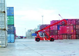 business_a_cargo_container_is_lifted_for_shipping_earlier_this_year_at_the_sihanoukville_autonomous_port_sahiba_chawdhary_0