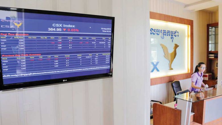 a-monitor-displays-stock-information-next-to-the-reception-of-the-cambodia-securities-exchange-last-year-heng-chivoan