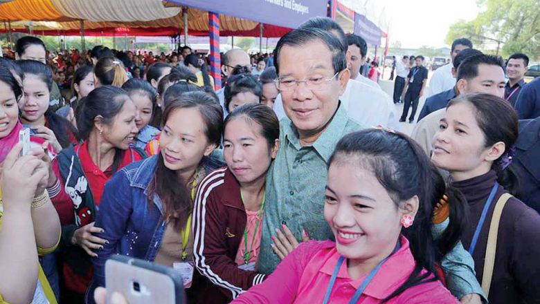 business-prime-minister-hun-sen-poses-for-a-photograph-with-garment-workers-at-an-event-on-wednesday-in-phnom-penh_-por-sen-chey-district_facebook