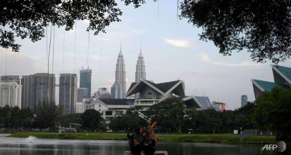 muslim-women-pose-for-a-selfie-against-the-kuala-lumpur-skyline-a-legislator-has-come-under-fire-for-his-comments-about-wives-1501060472584-4