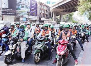 grab-bike-drivers-line-up-in-bangkok-on-may-3-the-nation