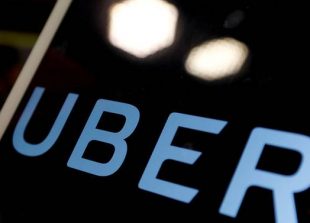 file-photo-the-logo-of-uber-is-seen-on-an-ipad-during-a-news-conference-to-announce-uber-resumes-ride-hailing-service-in-taipei-1