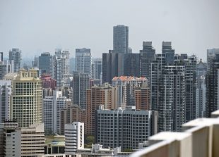 This photograph taken on August 19, 2019 shows an overview of highrise private condominiums in Singapore. - From luxury apartments in Singapore to Malaysian seafront condos, Hong Kongers are increasingly leaving the city to buy property in Southeast Asia, demoralised by increasingly violent protests as well as the China-US trade war. (Photo by Roslan RAHMAN / AFP) / TO GO WITH HongKong-China-SEAsia-politics-unrest-property,FOCUS by Sam Reeves and Catherine Lai