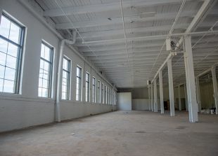 Newly painted industrial and commercial warehouse or factory. An empty construction zone.